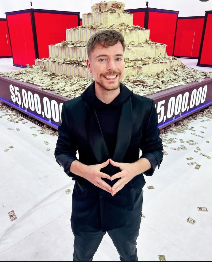 MrBeast (Jimmy Donaldson) smiling during a YouTube video challenge, with stacks of money in the background.